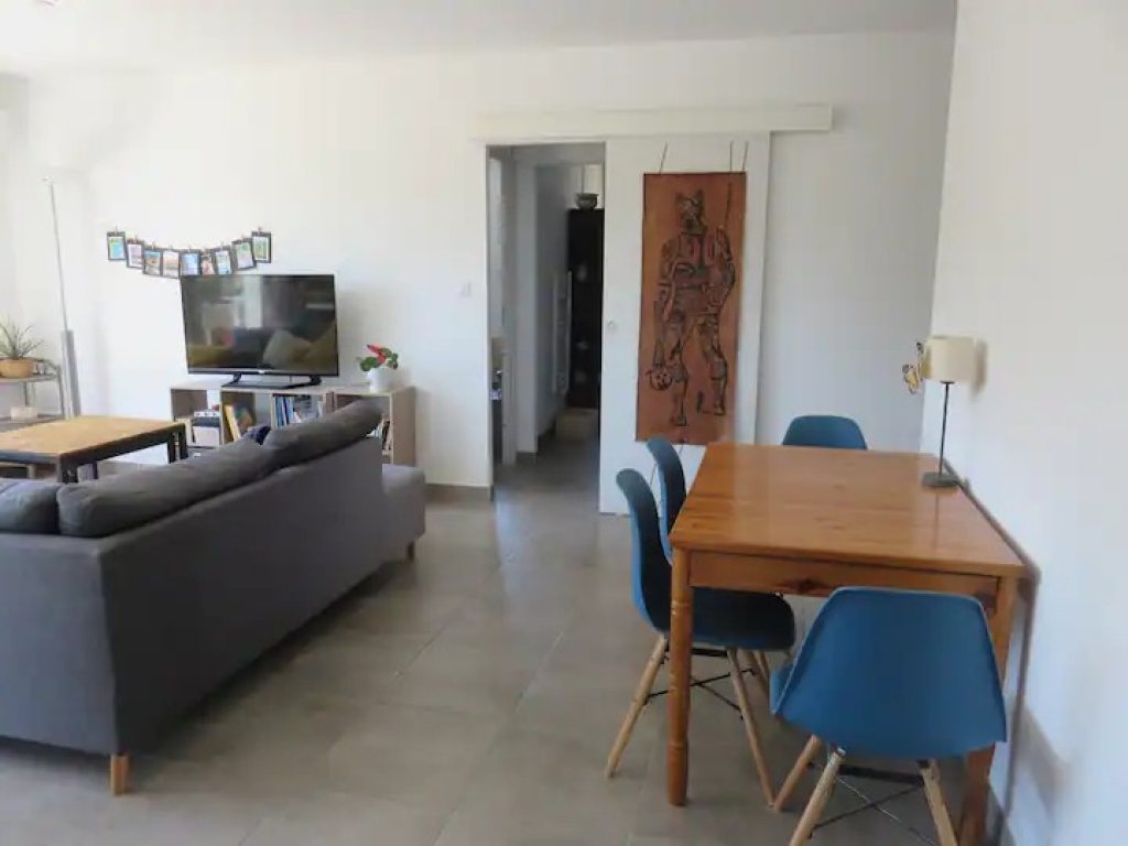 Salon avec accès extérieur à L’Hibiscus